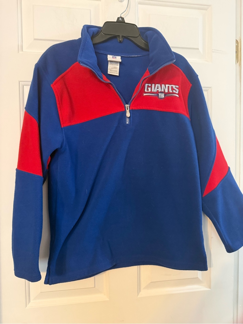 The product is a NFL Team Apparel 1/4 zip fleece top in blue and red, featuring